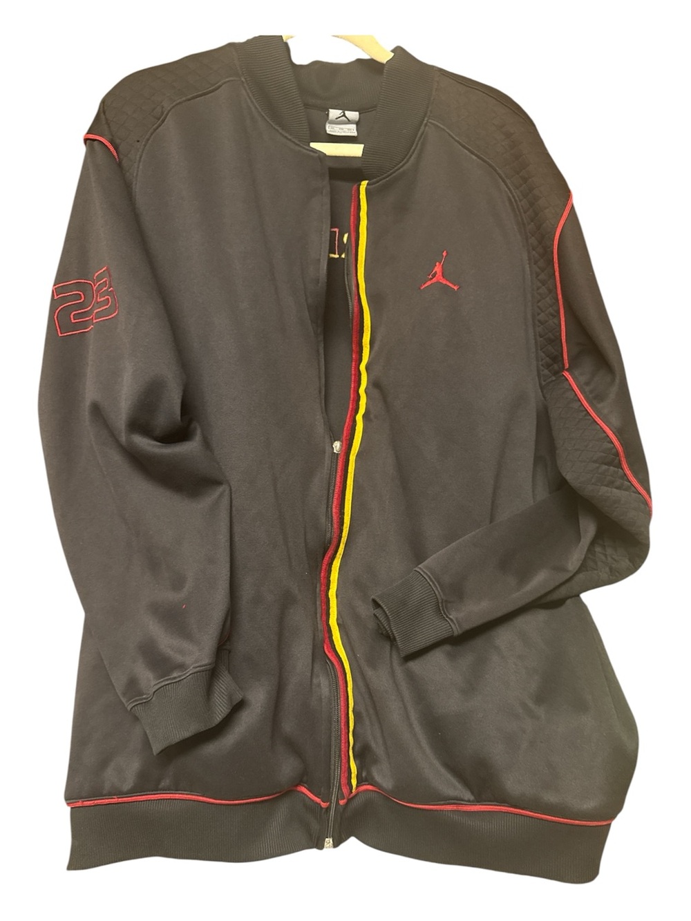 Jordon’s men’s full zip track jacket black with yellow and red trim. Size XXL